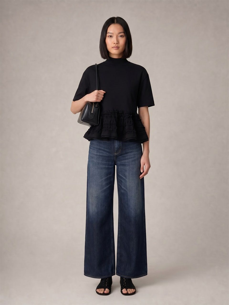 DONNA ALAIA TOP PEPLUM IN LANA VERGINE NERA 